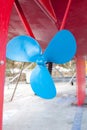 Blue sailboat propeller in a red hull