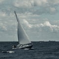 Blue sailboat at storm