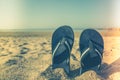 Blue sandal flip flop on yellow sand. Summer fun time and access Royalty Free Stock Photo