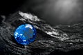 Blue sapphire on black coal background Royalty Free Stock Photo