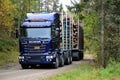 Blue Scania R730 Logging Truck on Autumn Forest Road