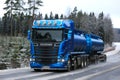 Blue Scania R580 Tank Truck Hauling on Rural Winter Highway Royalty Free Stock Photo