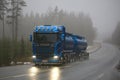 Blue Scania R580 Tank Truck Pushes Forward in Fog