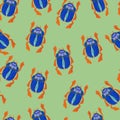 Blue scarab isolated on green background. Seamless pattern with Bug insect, Beetles. Design for wrapping paper, cover Royalty Free Stock Photo