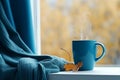 Blue scarf blue mug cozy. Generate Ai Royalty Free Stock Photo