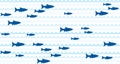 Blue school of fish swimming seamless pattern vector print. Royalty Free Stock Photo