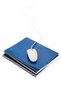Blue school textbook and computer mouse Royalty Free Stock Photo
