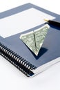 Blue school textbook and dollar Royalty Free Stock Photo