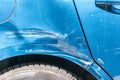 Blue scratched car with damaged paint in crash accident on the street or collision on parking lot in the city Royalty Free Stock Photo