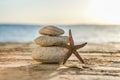 Blue Sea on Background Selective focus, zen stones on sea beach, meditation, spa, harmony, calm, balance concept Royalty Free Stock Photo