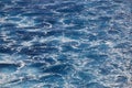 Blue sea background. Vessel ocean wake. Marine waves. Outdoor