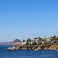 Blue sea, boats, mountains and small town on the coast of the Aegean sea. Summer holidays concept Royalty Free Stock Photo