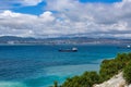 Blue sea with cargo ships against blue cloudy sky Royalty Free Stock Photo