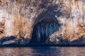 Blue sea and the characteristic caves of Cala Luna, a beach in the Golfo di Orosei, Sardinia, Italy. Big sea caves in the Royalty Free Stock Photo