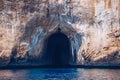 Blue sea and the characteristic caves of Cala Luna, a beach in the Golfo di Orosei, Sardinia, Italy. Big sea caves in the Royalty Free Stock Photo