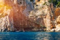 Blue sea and the characteristic caves of Cala Luna, a beach in the Golfo di Orosei, Sardinia, Italy. Big sea caves in the Royalty Free Stock Photo