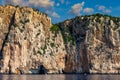 Blue sea and the characteristic caves of Cala Luna, a beach in the Golfo di Orosei, Sardinia, Italy. Big sea caves in the Royalty Free Stock Photo