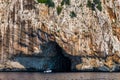 Blue sea and the characteristic caves of Cala Luna, a beach in the Golfo di Orosei, Sardinia, Italy. Big sea caves in the Royalty Free Stock Photo