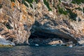 Blue sea and the characteristic caves of Cala Luna, a beach in the Golfo di Orosei, Sardinia, Italy. Big sea caves in the Royalty Free Stock Photo