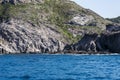 Blue sea and characteristic caves of Cala Luna Golfo di Orosei Sardegna or Sardinia Italy