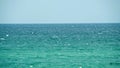 Blue sea and a clear blue sky. Shot. Beautiful view of the calm sea on a Sunny day Royalty Free Stock Photo