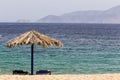 Blue sea, golden sand, sunbeds and umbrellas on the beach. Ios i Royalty Free Stock Photo