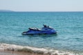 Blue sea and a jet ski floating on Aegean sea. Royalty Free Stock Photo