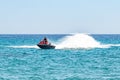 Blue sea and a jet ski floating on Aegean sea. Royalty Free Stock Photo