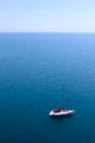 Blue sea and lonely white boat