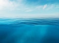 Blue sea or ocean water surface and underwater with sunny and cloudy sky Royalty Free Stock Photo