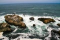 Blue sea and ocean waves  on the shoreline near the rocky coast of California Royalty Free Stock Photo