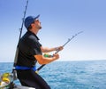 Blue sea offshore fishing boat with fisherman Royalty Free Stock Photo