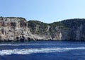 Blue sea with rocky cliff Royalty Free Stock Photo