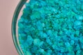 Blue sea salt in glass bowl, closeup view Royalty Free Stock Photo