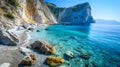 The blue sea, sand and rocks on a beautiful Mediterranean beach