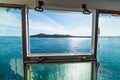 Blue sea in Sardinia seen through a ferry boat window Royalty Free Stock Photo