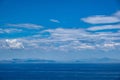 Blue sea and sky background, blue shades and white clouds Royalty Free Stock Photo