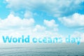 Blue sea and sky with clouds, with the text world ocean day. Concept of world ocean day and conservation of the environment. Copy Royalty Free Stock Photo