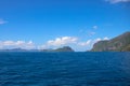 Blue sea and sky landscape with distant island. Palawan island hopping seascape. Philippines travel photo