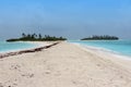 Blue sea with small deserted island