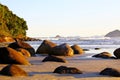 Paradise tropical. Blue sea with small white waves. In the background, the sky was clear. In front of small stones in the water. R Royalty Free Stock Photo