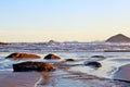 Paradise tropical. Blue sea with small white waves. In the background, the sky was clear. In front of small stones in the water. R Royalty Free Stock Photo