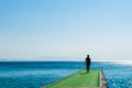 Man goes to the green pier to dive