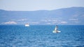 Blue Sea with two boats and kids on a slide