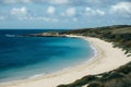 Blue sea water meets sandy beach, tranquil coastal scene