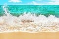 Blue sea water wave splash, turquoise ocean water waves spray, white foam, yellow sand, tropical island beach landscape, sunny sky Royalty Free Stock Photo