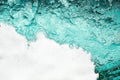 Blue sea water white foam texture background closeup, foamy ocean wave pattern, aqua bubbles surface, swimming pool backdrop Royalty Free Stock Photo