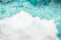 Blue sea water white foam texture background closeup, foamy ocean wave pattern, aqua bubbles surface, swimming pool backdrop Royalty Free Stock Photo