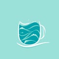 Blue sea with waves and foam in a cup of coffee. Storm in a tea cup. Sea and ocean time Royalty Free Stock Photo