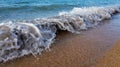 The white wave bubble hits the shore of a beautiful long sand beach. Royalty Free Stock Photo